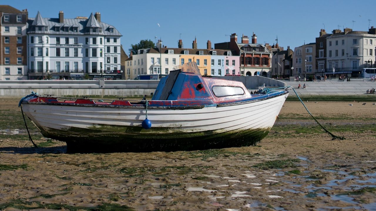 Boat on the mud at Margate Harbour
