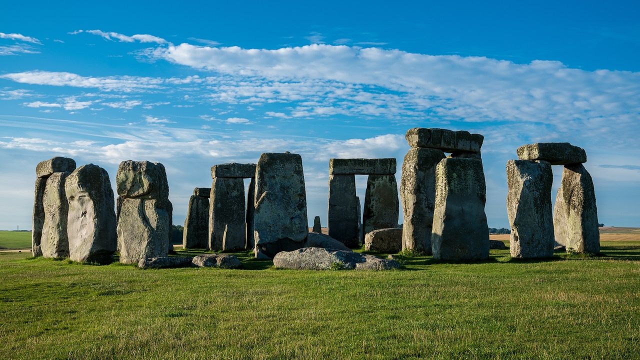 Stonehenge with clouds and blue sky background