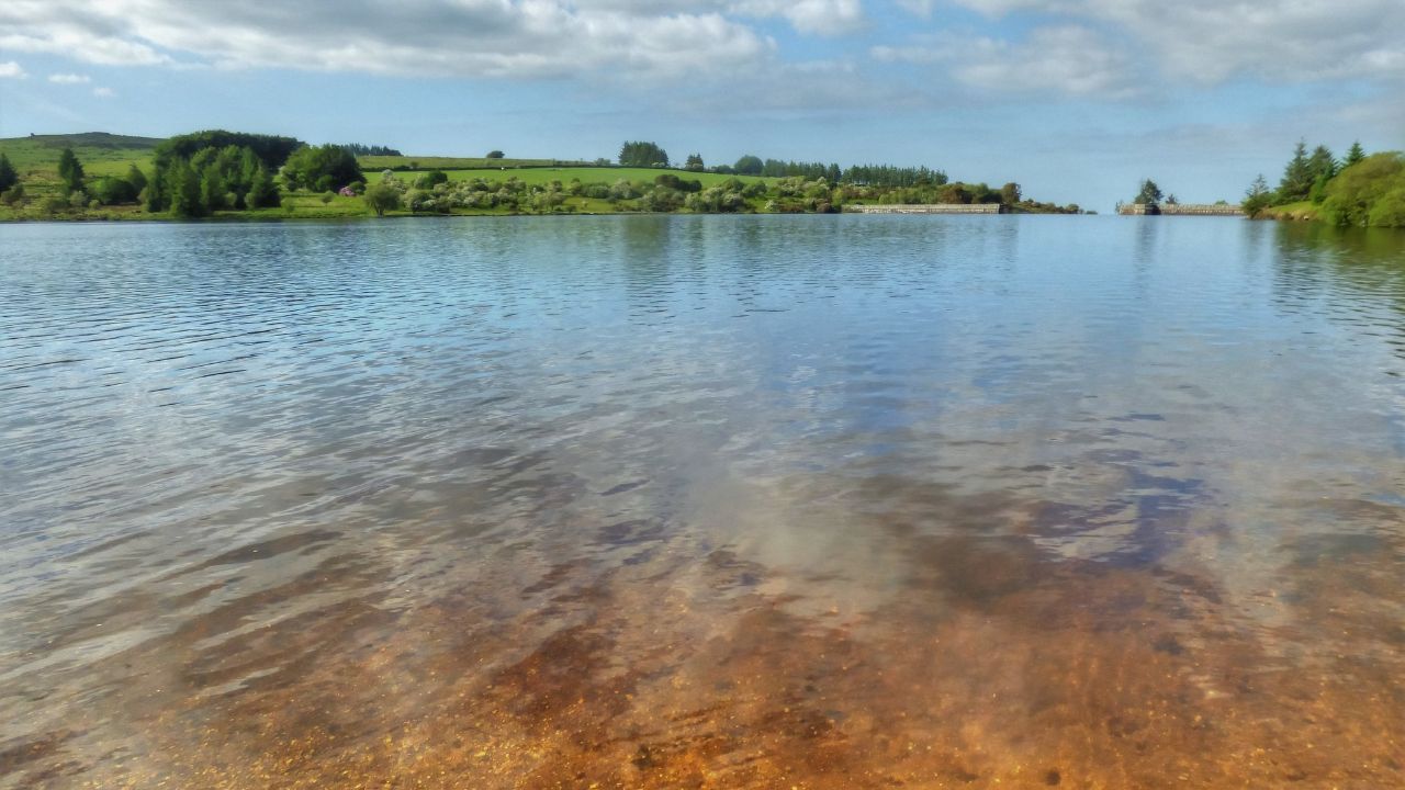 Fernworthy Reservoir with blue skies