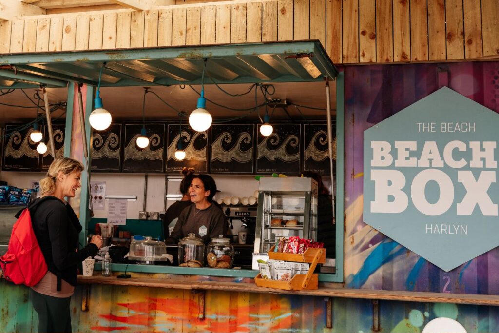 A customer speaking to a worker at a food outlet
