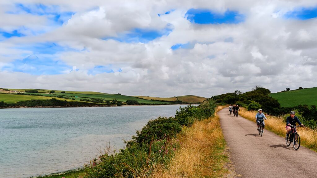 Cyclists riding along the Camel Trail, Cornwall