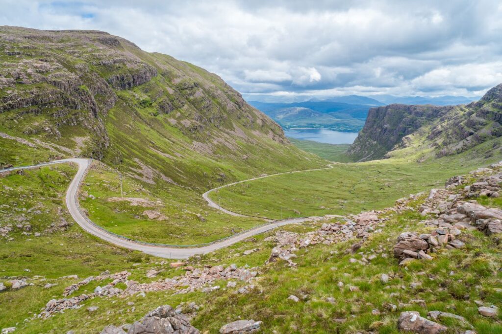 Bealach Na Ba road in Scotland surrounded by mountains