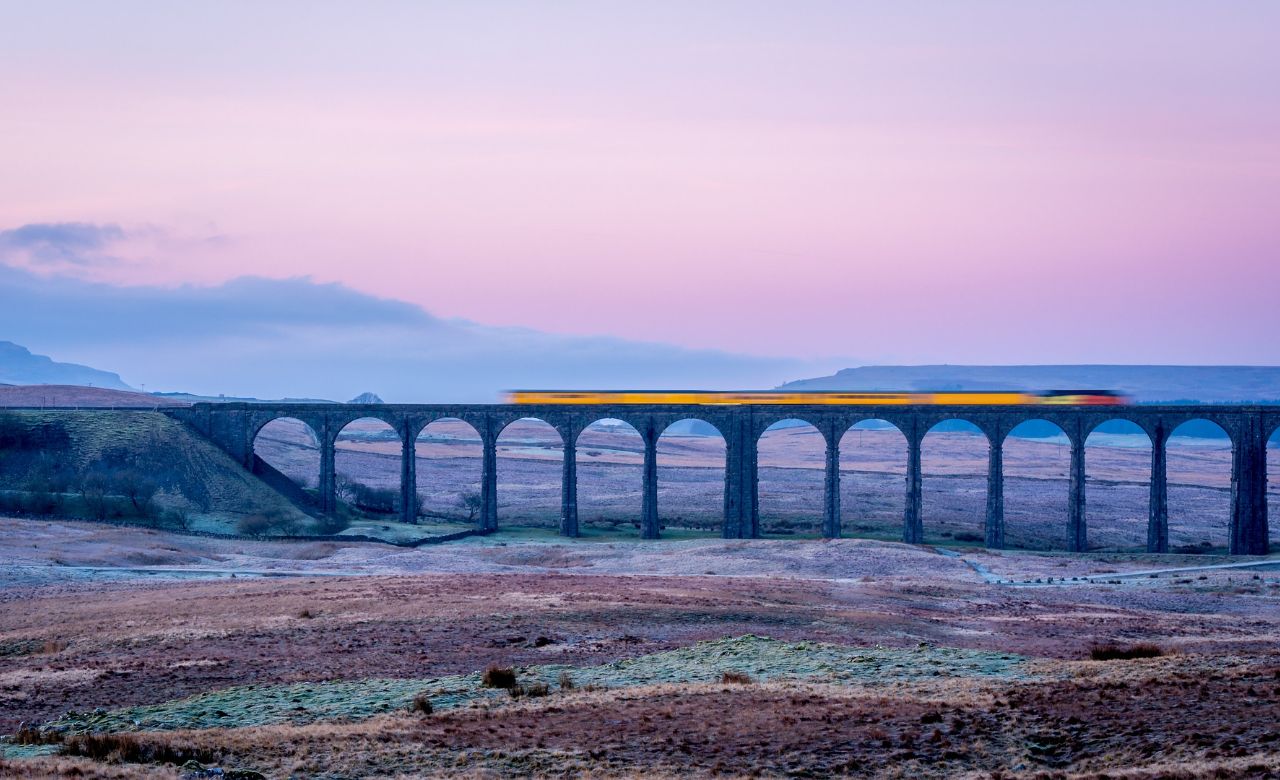 Viaduct with train and the Yorkshire Dales
