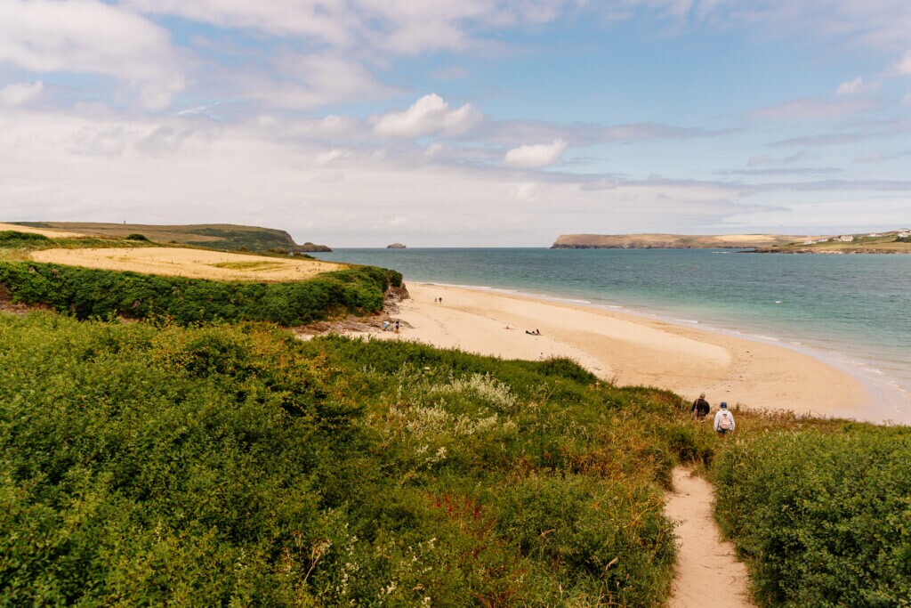 Cornwall beach couple walking