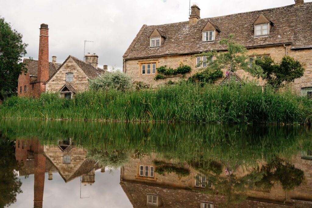 Building reflected in calm river
